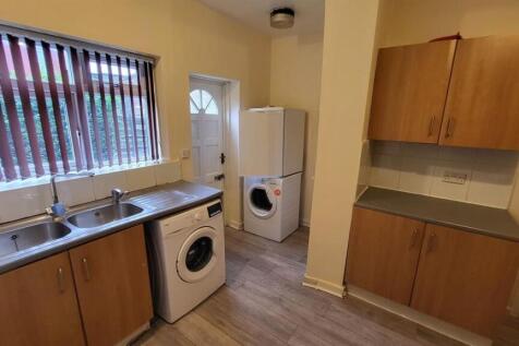 A well-organized kitchen area with natural ligh...