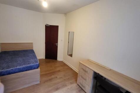 A tidy and well-maintained bedroom with a singl...
