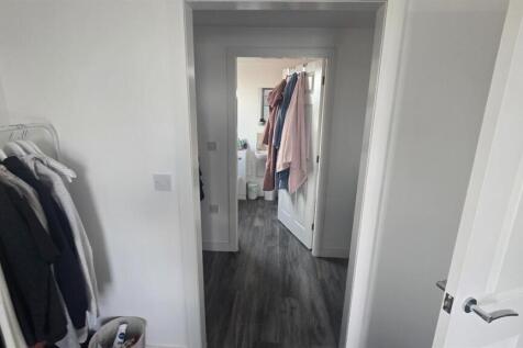 A spacious and bright master bedroom featuring ...