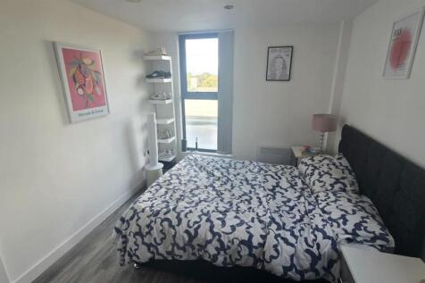 Bright and inviting double bedroom with natural...