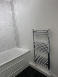 A clean and functional bathroom featuring a bat...