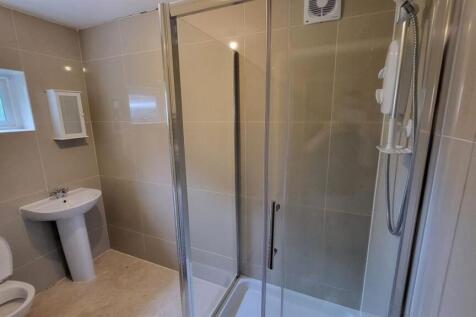 A clean and modern bathroom featuring a spaciou...