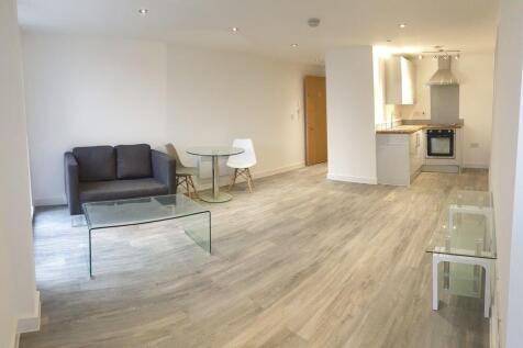 A spacious and modern living room with ample na...