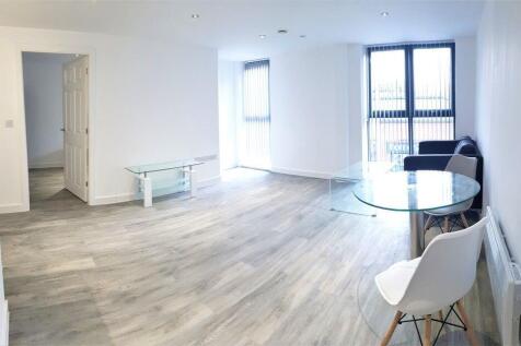 A bright, well-lit contemporary living room wit...