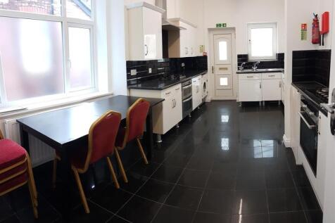 Bright and modern kitchen with ample workspace,...