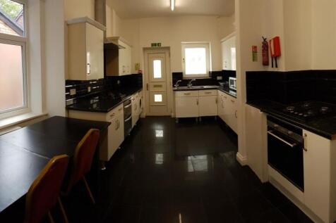 A well-lit, modern kitchen with ample counter s...