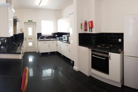Bright and modern kitchen area featuring white ...