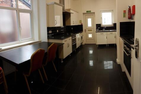 A bright and modern kitchen with ample counter ...