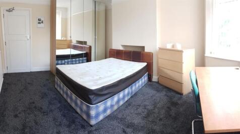 A clean and well-lit small bathroom with a WC, ...