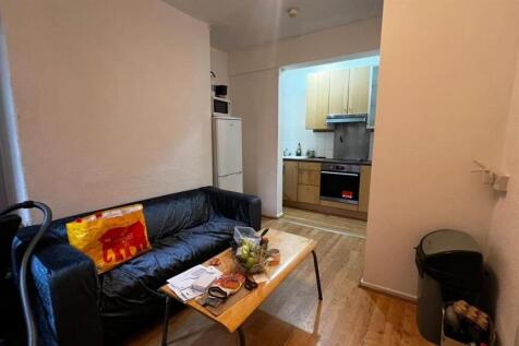 A cozy living room featuring a comfortable sofa...