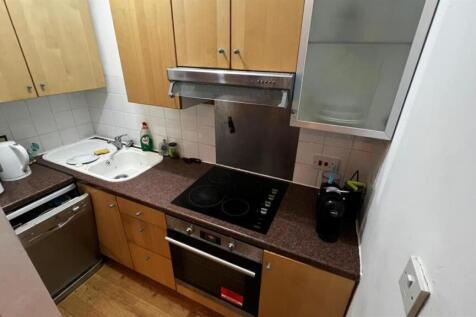 A well-maintained kitchen equipped with essenti...