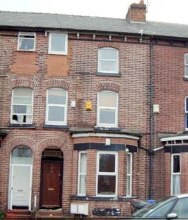 The front view of a traditional brick terraced ...