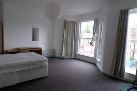 Spacious front-facing bedroom with large bay wi...