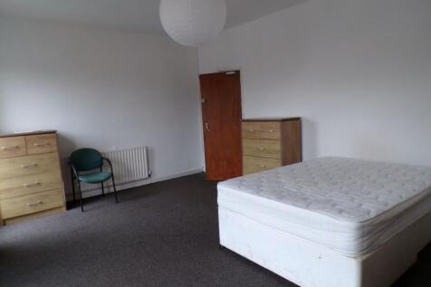 Bright, spacious bedroom with a double bed, two...