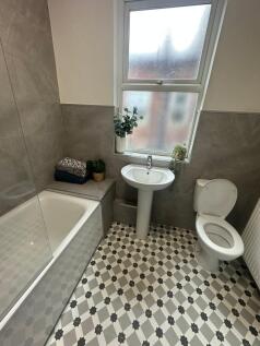 A well-maintained bathroom with a modern bathtu...