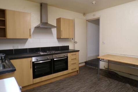 Bright kitchen with modern oven and hob, stainl...