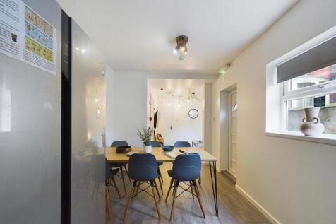 A modern and inviting kitchenette with a spacio...