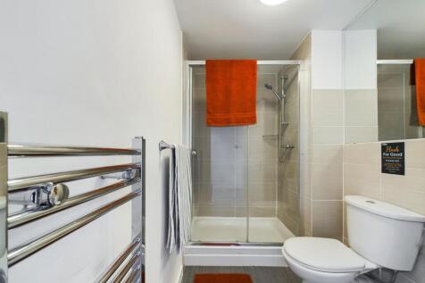 A modern and well-maintained bathroom featuring...