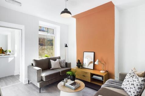 A spacious and stylish modern living room, perf...