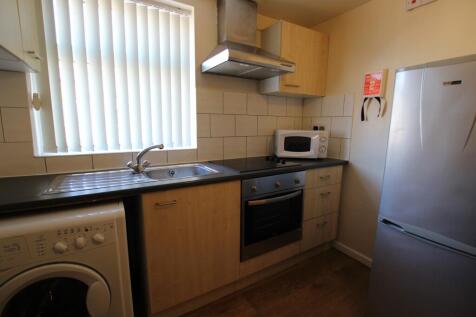 A bright and functional kitchenette with modern...