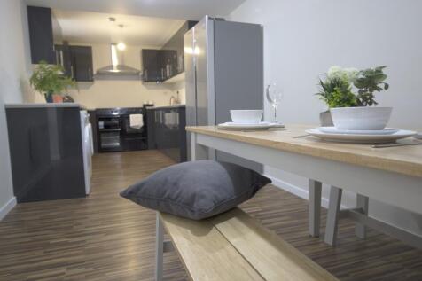 A modern and well-maintained kitchenette with s...