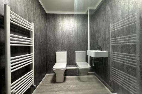 A modern and clean bathroom featuring contempor...