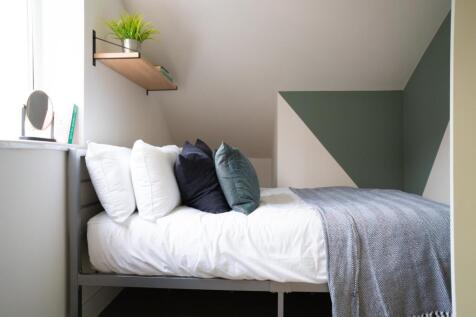 A stylish and cozy double bedroom featuring mod...