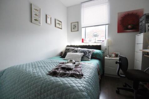 A cozy and inviting double bedroom featuring a ...
