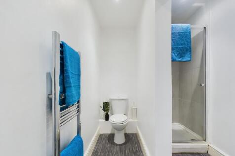 A bright and tidy bathroom featuring modern fix...