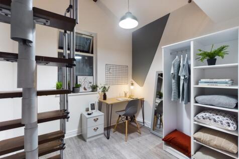 A stylish and tidy double bedroom featuring a s...