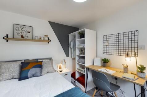 A bright and inviting double bedroom featuring ...