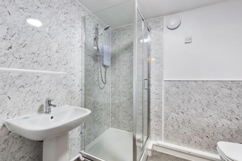 A clean and modern bathroom featuring a spaciou...