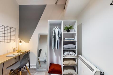 A tidy small storage area featuring a stylish w...