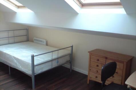 A bright and spacious double bedroom featuring ...