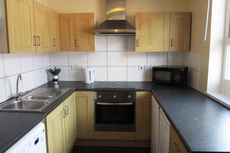 A bright and tidy kitchenette with modern appli...