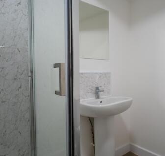 A modern and clean bathroom featuring a stylish...