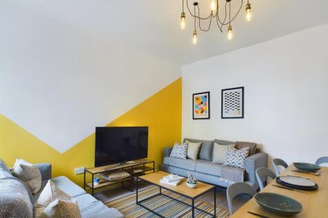 A stylish and inviting living room featuring co...