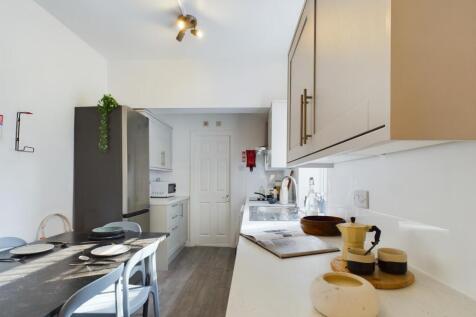 Bright and modern kitchen area featuring sleek ...