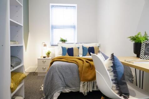 A bright and inviting double bedroom featuring ...