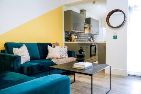 A bright and stylish contemporary living room f...