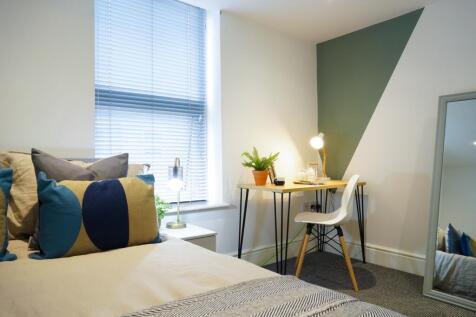 A beautifully designed double bedroom featuring...