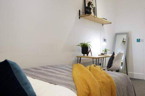 A beautifully designed double bedroom featuring...