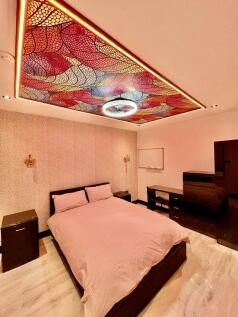 A stylish double bedroom featuring a cozy doubl...