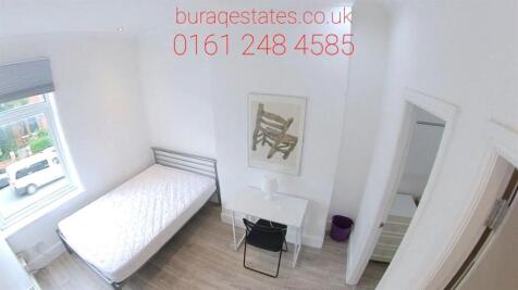 A bright and tidy double bedroom featuring a co...