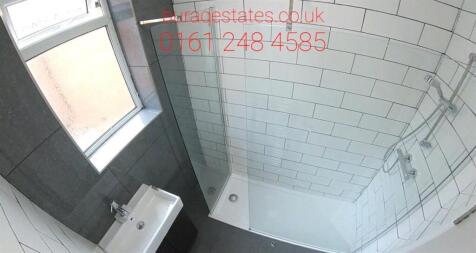 Modern and well-maintained bathroom with a spac...
