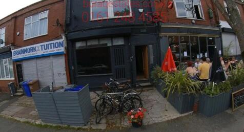 A charming street view showcasing the front ext...