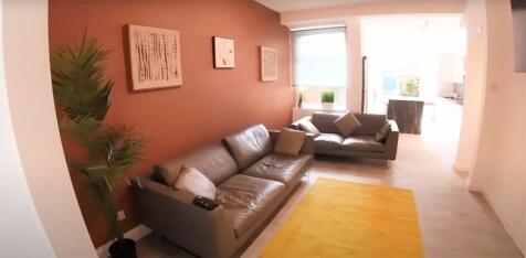 A bright and spacious contemporary living room ...