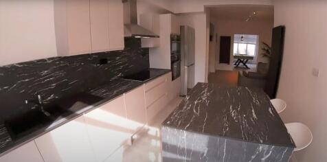 A modern and spacious living room filled with n...