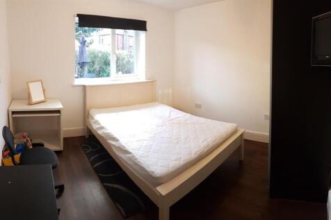 Bright and welcoming bedroom featuring a double...