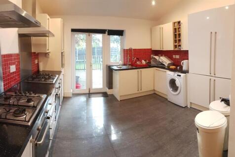 Bright and well-maintained kitchen with ample n...